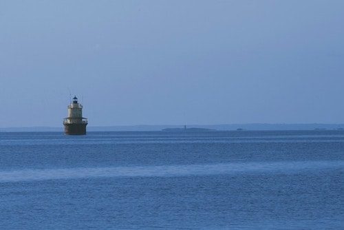 Things To Do In New Bedford Ma: Top 10 Most Unique Spots 12 Lighthouse out to sea off the coast of New Bedford Massachusetts