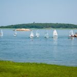 Things To Do In Ipswich Ma: Top 15 Most Unique Spots 17 Optimist dinghies in a local sailing camp sailing through a cove of Essex Bay in Ipswich MA