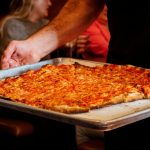New Haven apizza from BAR, served hot and on an unpretentious metal tray