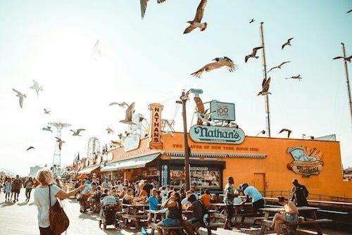 Boardwalk at Coney Island Beach, New York, a top pick for Labor Day getaway near me
