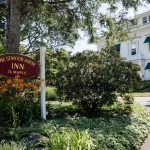 Front sign and facade of Stanton House Inn from Maple Avenue, home to elegantly charming hosting