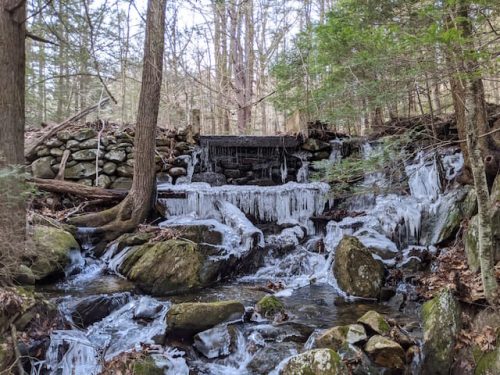 frozen waterfall in naugatuck state forest, along one of the best connecticut hiking trails