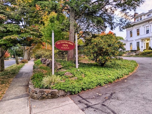 New England fall foliage around the sign of Stanton House Inn