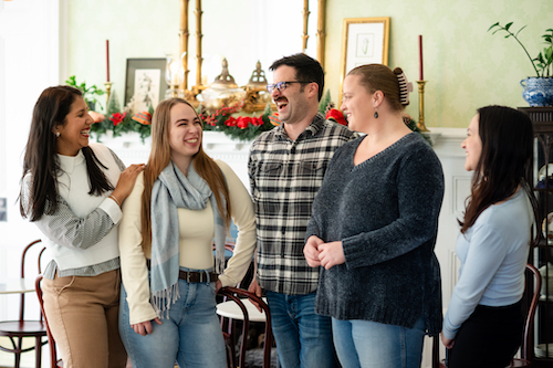 Stanton House Inn team enjoying a laugh in the dining room
