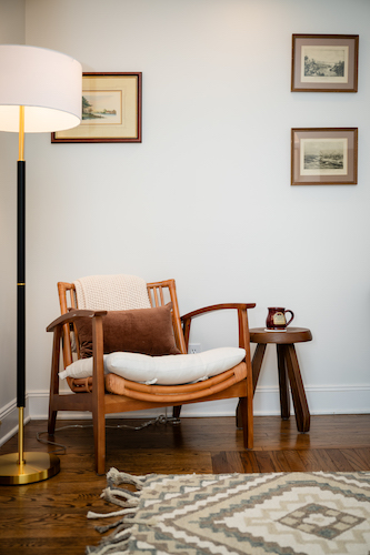 Rattan chair in the reading nook of Room 16