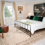 Room 14 at Stanton House Inn, Greenwich CT — a former family TV room now a ground-floor king with private entrance and patio