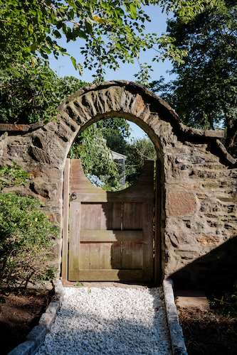 Garden gate leading to the natural beauty of the gardens at Stanton House Inn