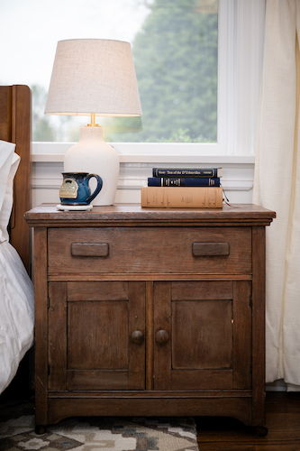 One of the nightstands in Room 16 is an antique jelly cabinet