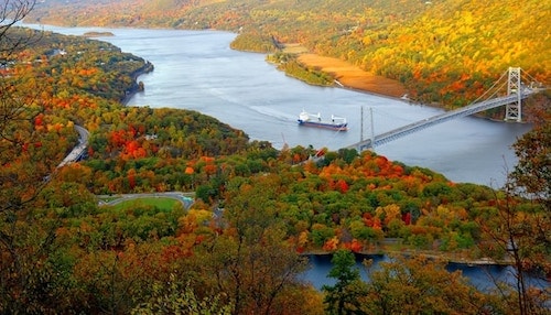 A tanker passes the Bear Mountain bridge on the Hudson River, as seen from the summit of Bear Mountain