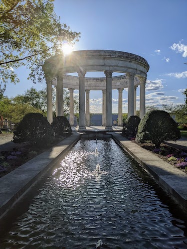 Sun passing behind a colonnade located in the Persian garden
