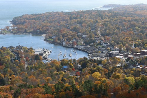 Fall foliage along a road trip along the New England coast in Camden, Maine, looking out towards the Atlantic Ocean