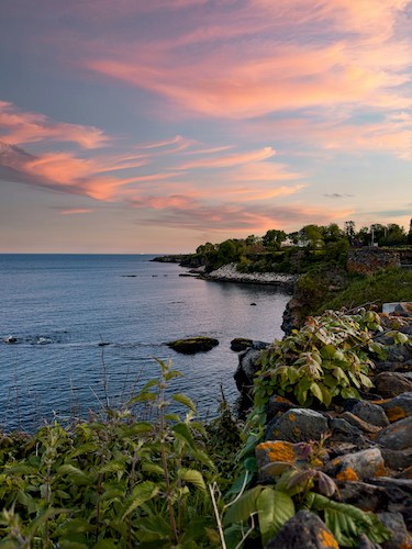 Sunset on the Cliff Walk, which passes many historical sites in Newport, Rhode Island