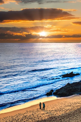 Sunrise over the beach of Ogunquit Maine, with a side of people watching