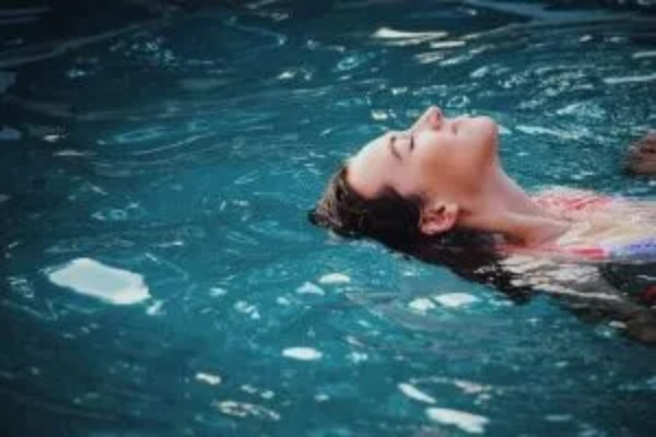 woman floating in a relaxing pool