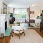 Brush Suite four-poster bed with fireplace seating area.